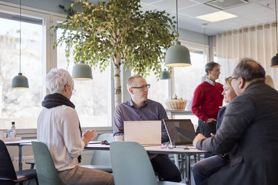 People taking during business meeting