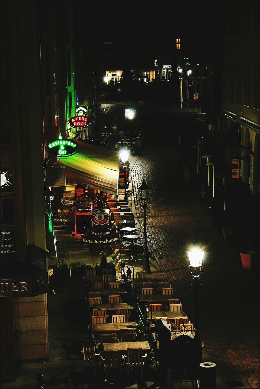 night, illuminated, building exterior, architecture, built structure, transportation, city, mode of transport, land vehicle, car, street, high angle view, street light, dark, building, city life, outdoors, light - natural phenomenon, nautical vessel, lighting equipment