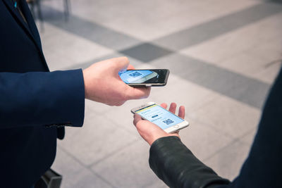 High angle view of man using mobile phone