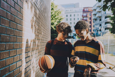 Men standing in city