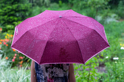 Close-up of woman holding umbrella