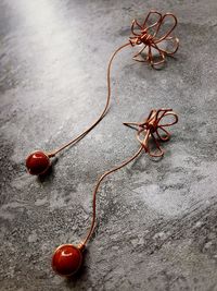 High angle view of earrings on table