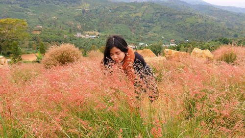 Woman looking at view of landscape