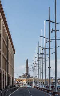 Street amidst buildings against clear sky