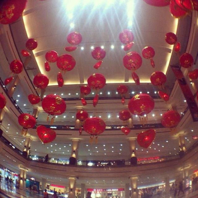 indoors, illuminated, decoration, lighting equipment, hanging, low angle view, ceiling, in a row, red, multi colored, large group of objects, celebration, arrangement, no people, still life, abundance, arts culture and entertainment, close-up, candle, tradition