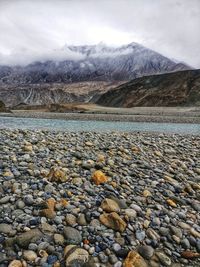 Surface level of stones against sky