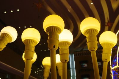 Low angle view of illuminated street light at night