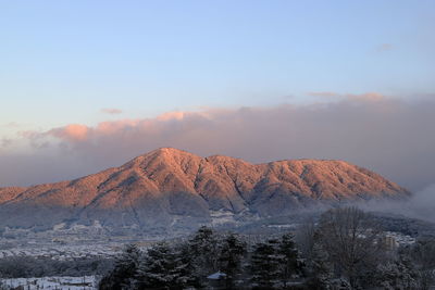 Scenic view of mountains against sky during winter