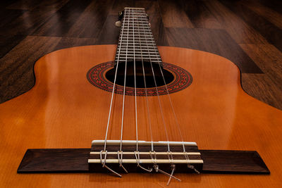 High angle view of acoustic guitar on table