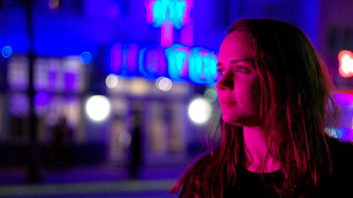 Close-up of young woman looking away