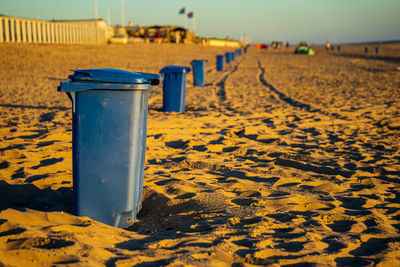 Close-up of yellow pipe on sand