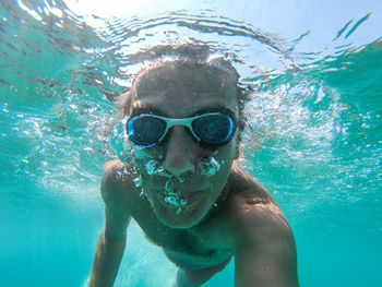 Portrait of man swimming in sea