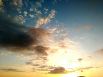 Low angle view of cloudy sky at sunset