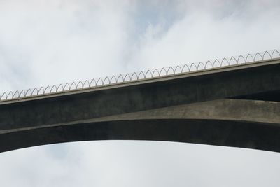 Low angle view of arch bridge against sky