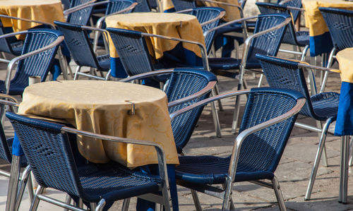 Empty chairs and tables at cafe