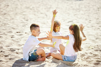 Friends sitting at beach