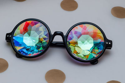 Close-up of sunglasses on glass table