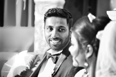 Close-up of couple looking at each other during wedding ceremony