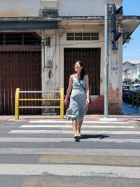 Full length of man walking on road