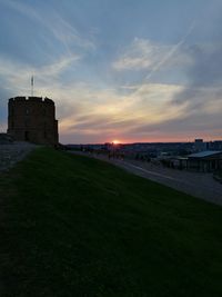 Scenic view of landscape against sky at sunset