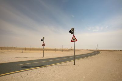 Road signal against clear sky