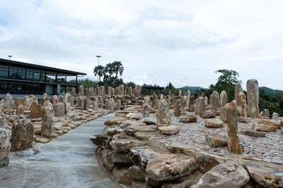 Panoramic view of rocks and building against sky