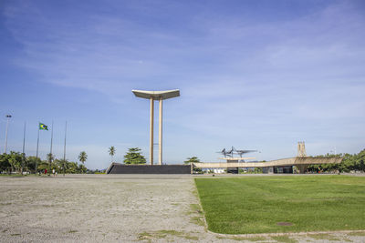 Built structure on field against sky in city