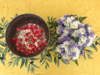 High angle view of various flowers in bowl on table