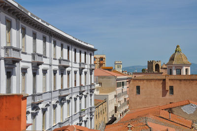 Buildings in city against sky