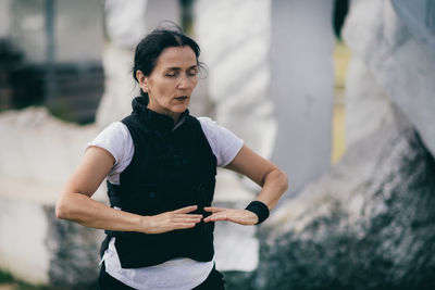 Woman practicing qi gong in the park