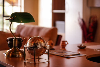 Close-up of lamp on table