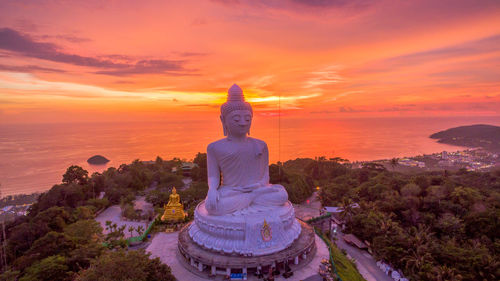 Statue against sky during sunset