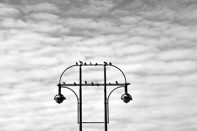 Low angle view of street light against sky
