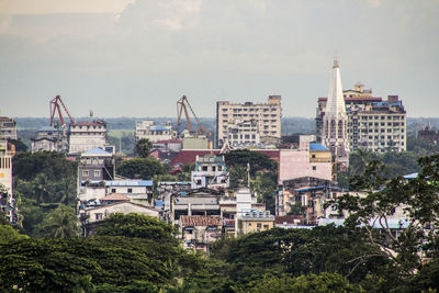 Buildings in city against sky