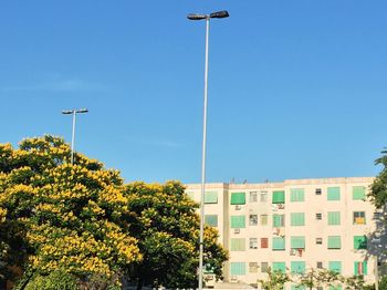 Low angle view of buildings against clear blue sky