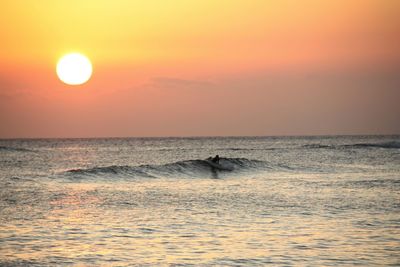 Scenic view of sea at sunset