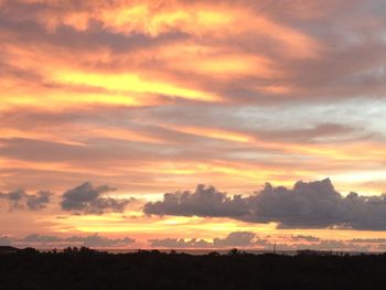 Scenic view of landscape at sunset