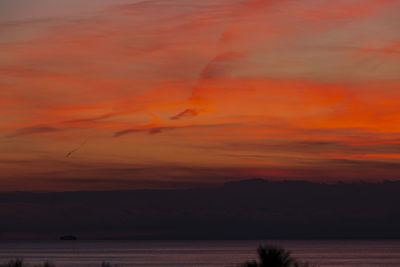 Scenic view of sea against orange sky