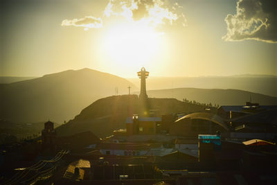 High angle view of illuminated buildings against sky during sunset