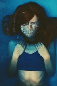 High angle view of young woman in bathtub