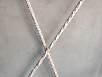 Close-up of rope tied on wall