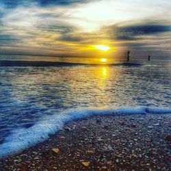 Scenic view of sea against dramatic sky