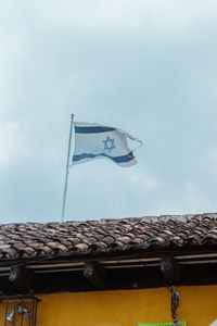 Low angle view of roof against sky