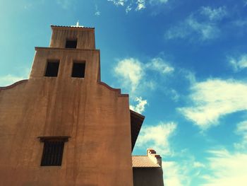 Low angle view of building against blue sky