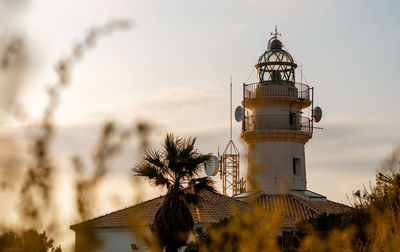 Sunrise over the lighthouse of cullera, valencia.