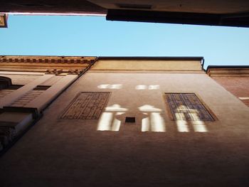 Low angle view of building against blue sky