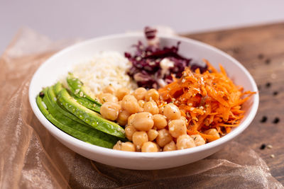 High angle view of chopped vegetables in bowl on table