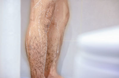 Low section of man in bathroom