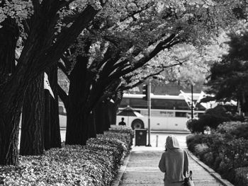 Rear view of woman walking on street