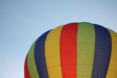 Low angle view of hot air balloon against clear sky